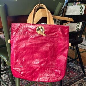 NWOT never used leather pink handbag.